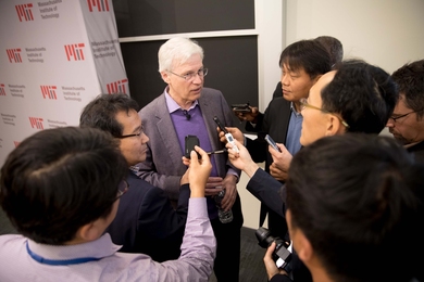 MIT Professor Bengt Holmström speaks with reporters after a press conference describing his newly-minted status as a Nobel laureate.
