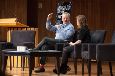 MIT Professor Daniela Rus (right), director of the Computer Science and Artificial Intelligence Laboratory, speaks with Alphabet chairman Eric Schmidt. 