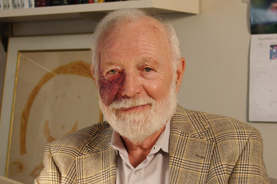 Photo of Isadore Singer sitting in his office