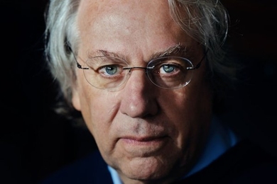Portrait headshot of Kerry Emanuel against a black background