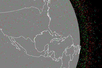 Animation shows an illustration of Earth, as seen from space, with tiny red, green, cyan, and white dots swarming around it, representing objects orbiting the planet