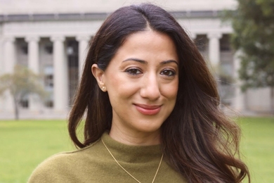 Ana Bakshi poses outside the MIT dome on a summer day
