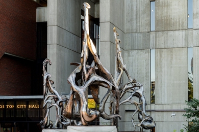 19-foot-tall metal sculpture “Amulet,” which looks a bit like knotted strands of natural fiber, stands before Boston City Hall.