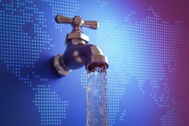 Water faucet over a world map