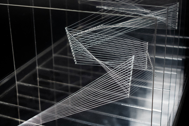 A layered sculpture resembling zig-zag patterns and geometric shapes