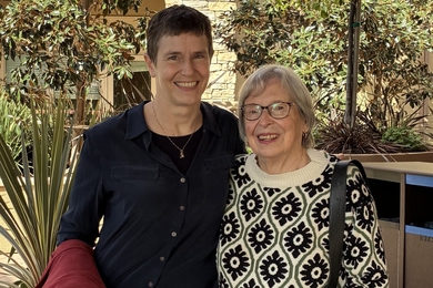 Amy E. Keating poses standing next to Harriet Latham Robinson