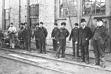 Monochromatic image of workers on sidewalk 