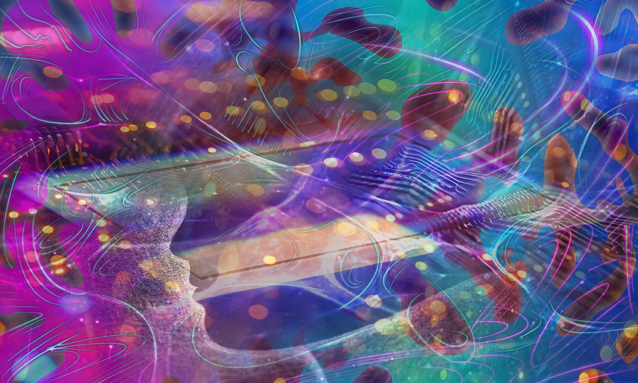 A colorful image with a computer chip, human silhouette, and abstract blobs of energy.