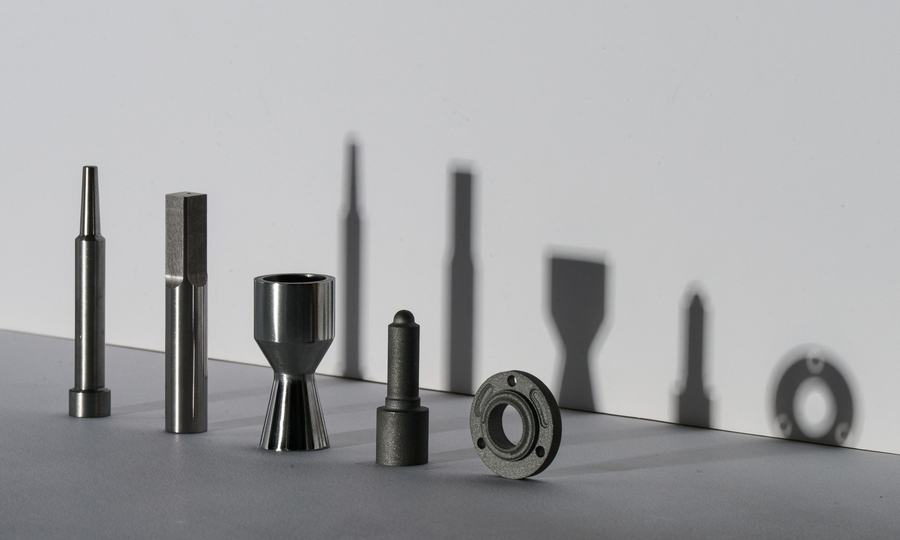 Five metal attachments for tools