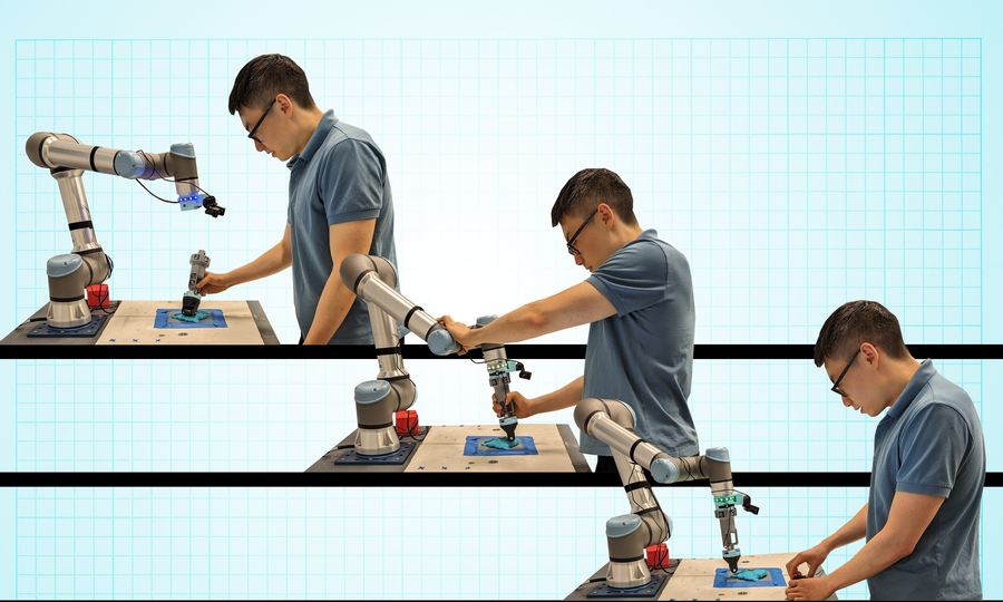 A person teaching a robot new skills with a handheld device