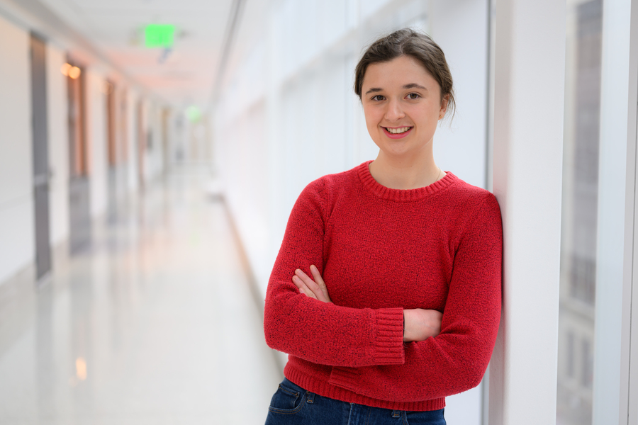 Miranda Schwacke in a brightly lit hallway
