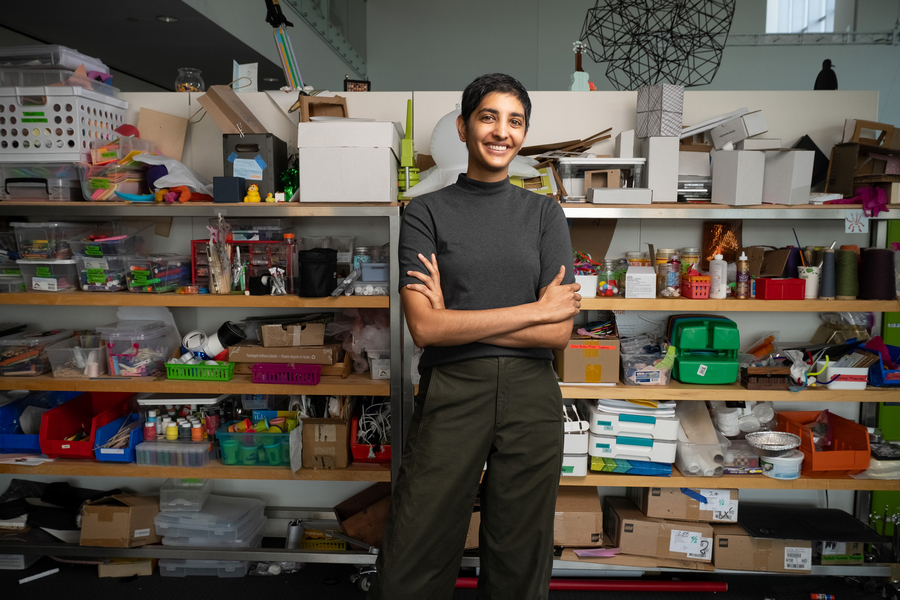Ila Kumar portrait in front of shelves full of art and craft supplies.