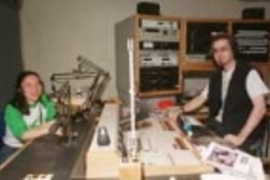 Former WMBR general manager Joyce C. Yang, a graduate student in biology (left) and current general manager Christopher Avrich, a senior in electrical engineering and computer science, work the boards in the radio station's studio.
