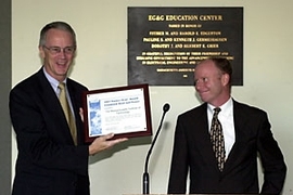 President Charles M. Vest (left) receives an award from Mike Kenyon of the U.S. Environmental Protection Agency and Department of Energy for increasing energy efficiency and reducing pollution at the William R. Dickson Cogeneration Facility.