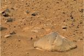 The camera on the Mars rover Spirit recorded this image of a football-size rock, officially named "Adirondack" by MIT Professor John Grotzinger. It was chosen as the rover's first target because its flat, dust-free surface is ideally suited for grinding.