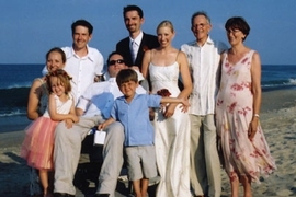 The Heywoods gather together for a family wedding in July 2004. Stephen is in the wheelchair with his brothers behind him: Jamie is at left; Benjamin is at center. Their parents, Professor John and Peggy Heywood, are at the far right. The bride is Benjamin's wife, Sherie. Stephen's wife, Wendy, is at the far left behind Jamie's daughter, Zoe. Stephen's son, Alex, is in front.