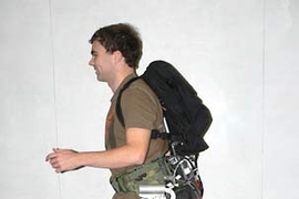 Graduate student Conor Walsh demonstrates a prototype of the 'exoskeleton' he and other MIT researchers have devised. The invention can successfully take on 80 percent of an 80-pound load carried on a person's back.