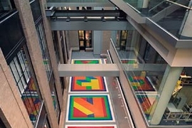 Dazzling colors reflect from Sol LeWitt's 'Bars of Color Within Squares (MIT), 2006' onto both the new Building 6C and Building 8, as seen from Building 4.