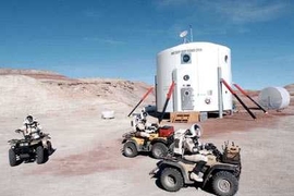 Crewmembers of an earlier mission at the Mars Society Desert Research Station in Utah set out for an exploratory trip on their all-terrain vehicles, wearing simulated space suits.