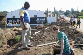 MIT graduate student Tijs Van Maasakkers, right, examines one of the water lines near Durban, South Africa.