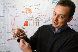 Brian Wardle, the Charles Stark Draper Assistant Professor in the Department of Aeronautics and Astronautics, shows an advanced composite material held together by "nanostitching," a technique developed at MIT that could make airplane skins and other products stronger.