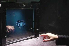 Media Lab researchers demonstrate a laboratory mockup of a thin-screen LCD display with built-in optical sensors.