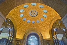 The grand dome features the characteristic Guastavino herringbone tile pattern.