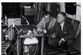 Charles Stark Draper, right, and CBS journalist Eric Sevareid take a look at the automatic navigation system developed by the MIT Instrumentation Laboratory. In 1958, Sevareid, Draper and several I-Lab staff members made a nationally televised cross-country flight piloted by the system. 