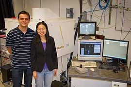 Research Laboratory of Electronics graduate students Vitor Manfrinato and Lin Lee Cheong, with the electron-beam lithography system they used in their experiments.