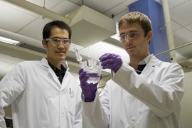 Materials Science and Engineering Graduate Student Jin Suntivich (left) and Mechanical Engineering Graduate Student Kevin J. May (right) inspecting the electrochemical cell for oxygen evolution reaction experiment.