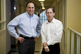 Professors Robert Langer, right, and Michael Cima pose for a portrait outside their labs at the David H. Koch Institute for Integrative Cancer Research.