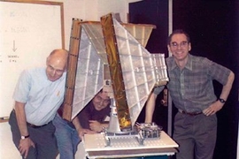 The All-Sky Monitor team assembles around the X-ray monitoring instrument. From left, Hale Bradt, Ed Morgan, Alan Levine; bottom, Ron Remillard.