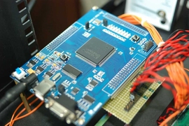 A photo of an Xilinx field-programmable gate array, or FPGA.