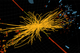A proton-proton collision event in the CMS experiment producing two high-energy photons (red towers). This is what is expected to be seen from the decay of a Higgs boson but it is also consistent with background Standard Model physics processes.
