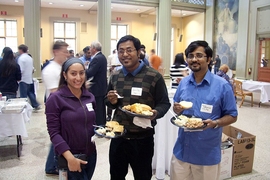 A few postdocs socialize during an event in Walker Memorial.