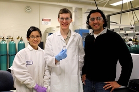 Paper authors (l-r) Yuran Wang, William Gunther and Yuriy Roman show a sample of the inorganic catalyst Sn-Beta zeolites with borate salts