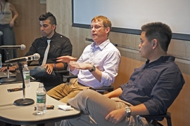 Team members, from left, Bobak Ferdowsi SM '03, Steve Sell and Allen Chen '00, SM '02 relive the landing of the Mars Curiosity rover.