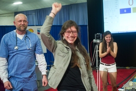 Aguirre celebrates her victory, after being carried around the competition field on Frey's back in a traditional victory lap.