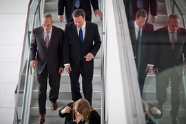 MIT President L. Rafael Reif (left) leads Prime Minister David Cameron on a lab tour.