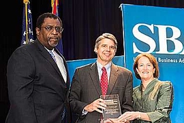 (Editor&#39;s note: photo added on Aug. 1, 2013): Eric Evans, director of Lincoln Laboratory, accepts the Eisenhower Award from Calvin Jenkins (left), deputy associate administrator for government contracting and business development, and Karen Mills, administrator, both of the Small Business Administration.