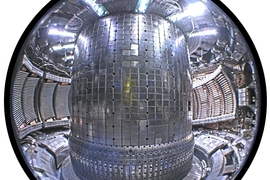 Interior view of the tokamak showing the molybdenum armor tiles on the wall. Three Ion Cyclotron Range of Frequencies (ICRF) heating antennas are visible – two on the left with two copper straps each, and the four-strap “field-aligned” antenna (installed 2011) at right.
