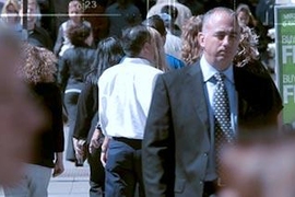 Crowded crosswalk with overlay of digital numbers