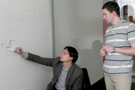 Collaborators, Jeff Gore (left) of MIT and Kirill Korolev of Boston University discuss joint research into range expansions. They suggest applying ecological and evolutionary lessons from dynamics of microbial populations to treating human cancers in a paper co-authored with Joao B. Xavier of the Memorial Sloan-Kettering Cancer Center.