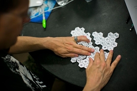A Mystery Hunt participant arranges parts of a puzzle. The 2015 hunt contained more than 160 puzzles, ranging from crosswords to treasure maps to tasks like charades.