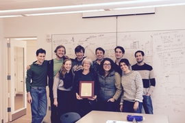 Professor Nancy Kanwisher and lab members celebrate her award.