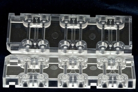 AIM Biotech's microfluidics device (shown here) has an array of culturing sections, each with three chambers: a middle chamber for hydrogel and any cell type, and two side channels for culturing additional cell types.