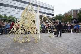 Theo Jansen presents "Animaris Ordis," one of his Strandbeests, in front of the MIT Media Lab.