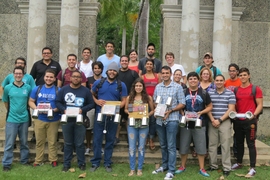 Students from the University of Puerto Rico at Mayagüez, photographed here with MIT Lincoln Laboratory instructors for a three-day build-a-radar workshop, show off the small "coffee-can" systems they built and demonstrated.