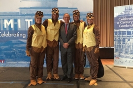 MIT President Reif with several golden beavers