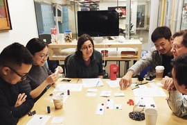 STL Lab and MIT Game Lab project participants work together to develop and test a socially responsible real estate game.